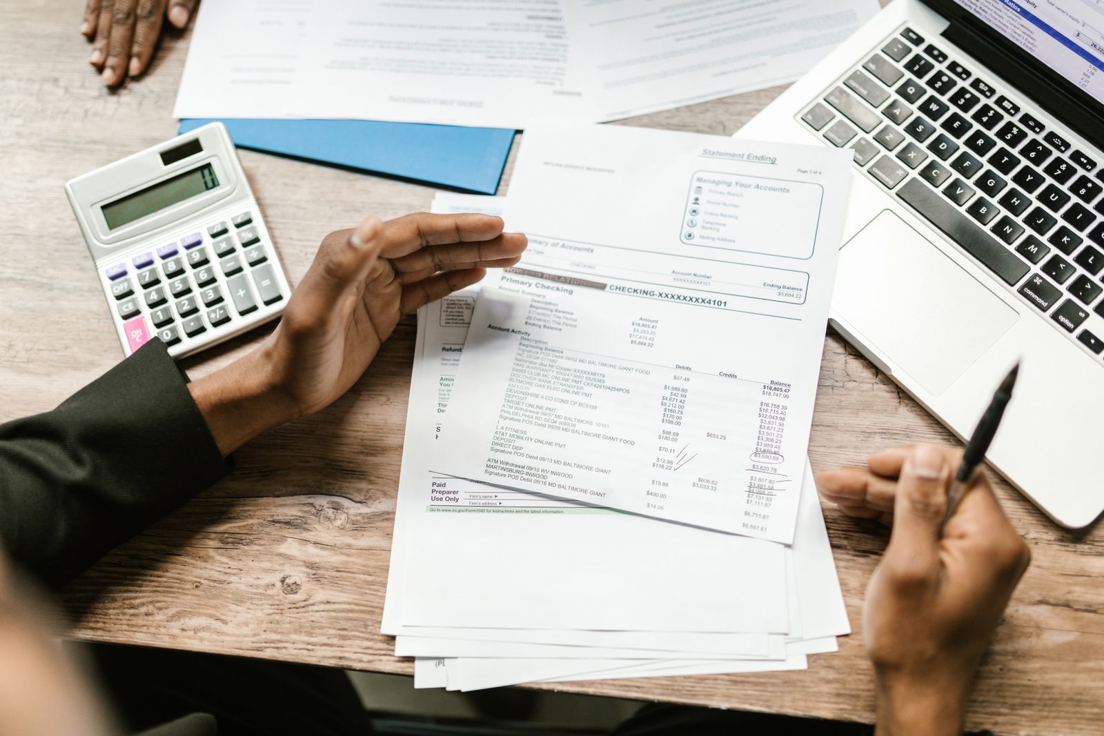 An accountant reconciling bank and credit card statements against the general ledger on a weekly cadence